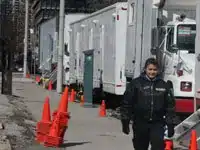 Uniformed security guard patrolling active film production location in Toronto Ontario