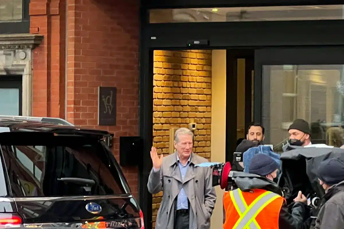 Security officer actively patrolling film production set in Toronto ensuring cast and crew safety