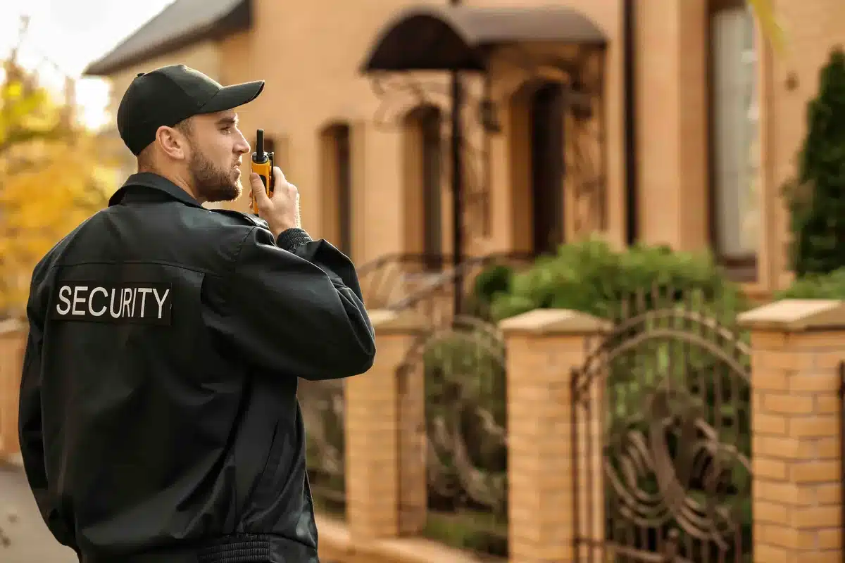 Professional security guard stationed at movie set entrance in Toronto preventing on-set disruptions